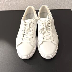 Kizik White slip on sneaker.